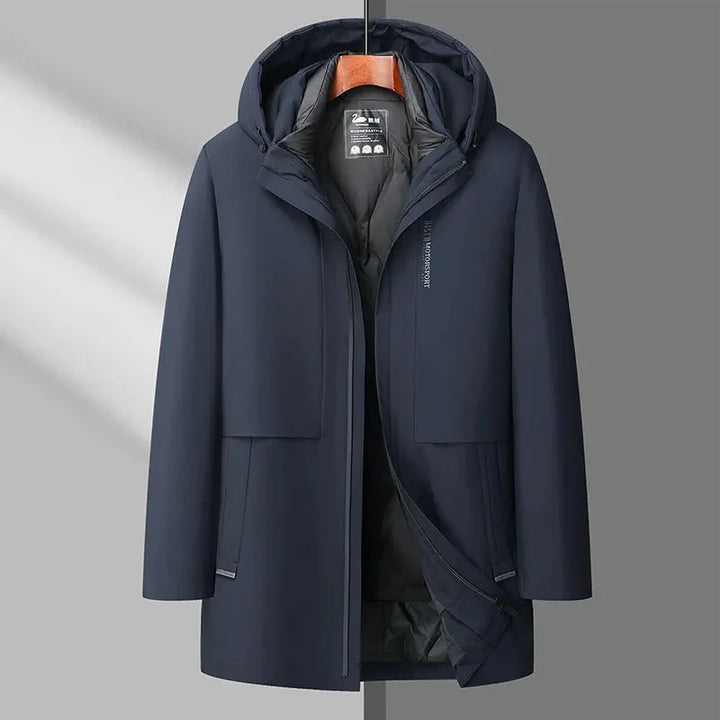 Navy blue coat on a hanger against a gray background