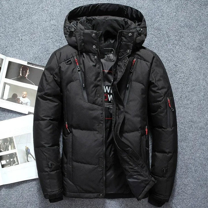 Black winter jacket with red accents on a gray background